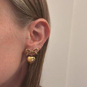 The Catherine gold heart bow dangling chunky hoops hoop earrings